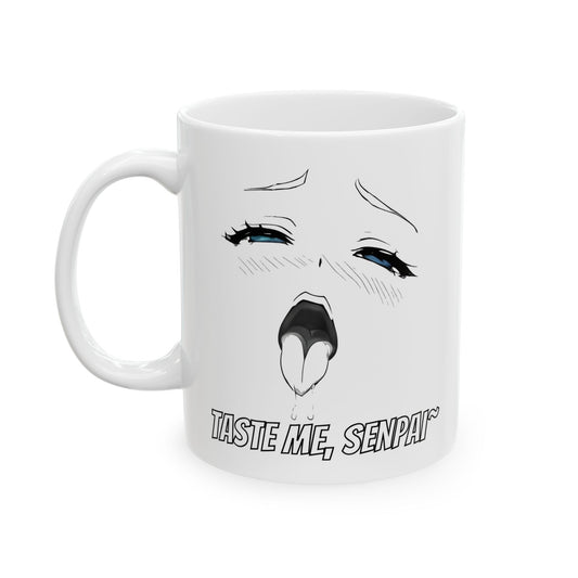 Ahegao meme mug featuring a black-and-white anime-style face in an exaggerated lewd expression. The eyes are bright blue, rolled back with dramatic lashes and tear drops, while the mouth is open with a dripping tongue. Below the face, the text reads “Taste Me, Senpai~” in bold manga font. The mug’s design is bold, spicy, and intentionally NSFW — a perfect chaotic accessory for meme lovers, anime degenerates, or anyone looking to horrify coworkers with style.